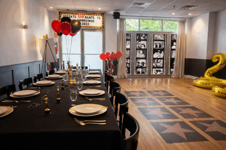 Graduation dinner celebration at The Space Next Door, a private event venue in Ridgewood, Queens featuring custom décor, in-house catering, open bar service, and AV-ready space for milestone events.
